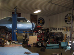 Vintage Chevy auto parts warehouse, classic Chevy car NOS replacement parts, vintage Chevrolet car parts, engines, fenders, hoods